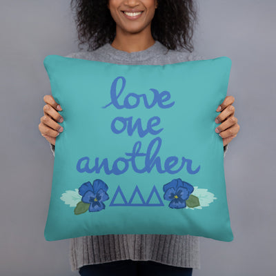 Tri Delta Love One Another Pillow shown with model