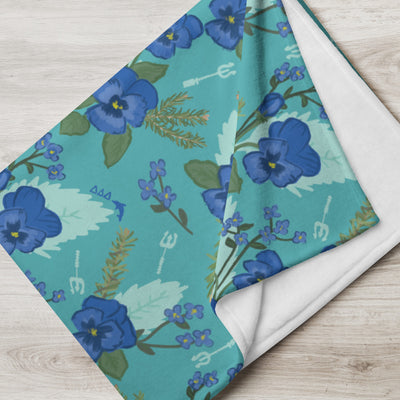 Tri Delta Pansy Floral Print Teal Throw Blanket showing white reverse side