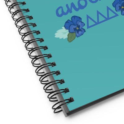 Tri Delta Love One Another Spiral Notebook shown close up 