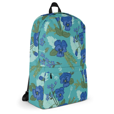 Another side view of the Tri Delta Pansy Floral print backpack with a teal background showing front zipper pocket.