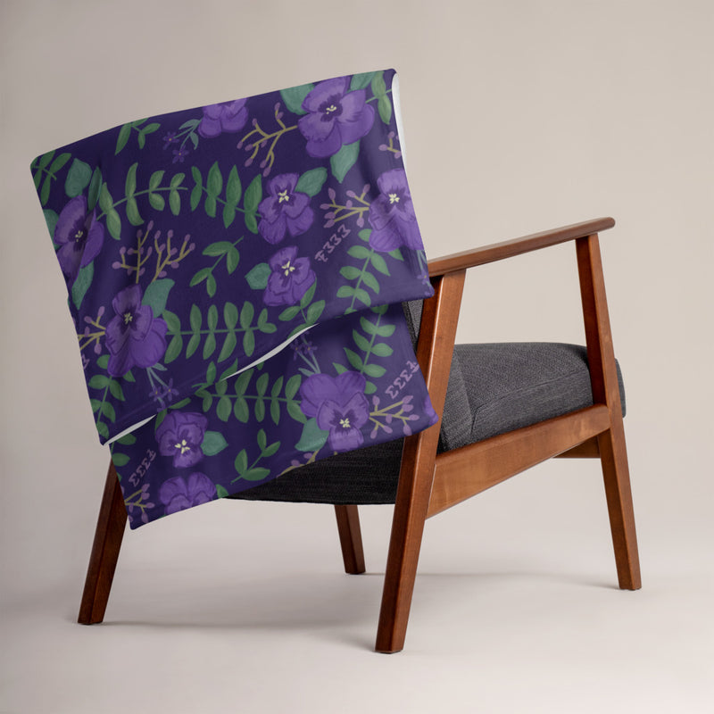 Tri Sigma Violet Throw Blanket, Purple on chair