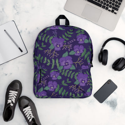 Tri Sigma violet floral print backpack in purple shown in lifestyle setting