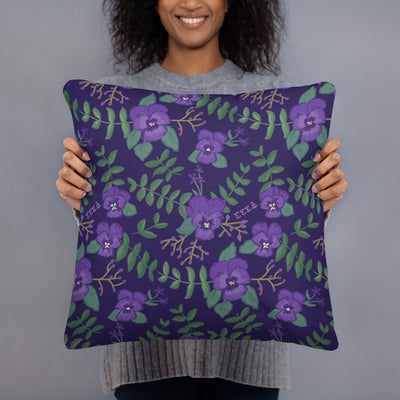 Tri Sigma Sailboat Mascot Pillow in model's hands showing violet floral print on back
