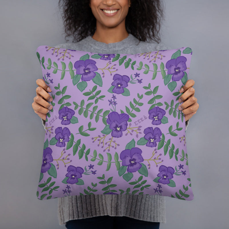Tri Sigma Motto Pillow showing violet floral print on back in model&