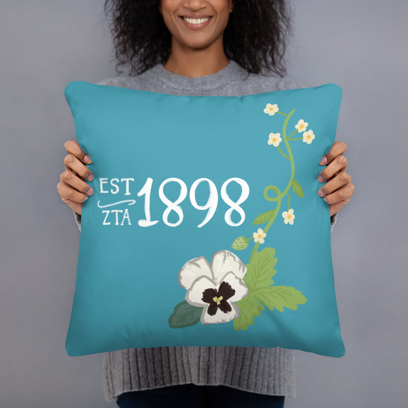 Zeta Tau Alpha 1898 Founding Date Pillow in Turquoise shown with woman
