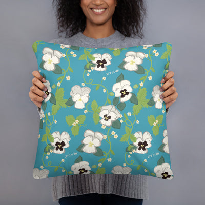 Zeta Tau Alpha Sorority Pillow showing white violet floral print in turquoise on back in model's hands