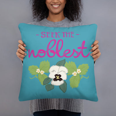 Zeta Tau Alpha Seek The Noblest Pillow in turquoise held up by woman