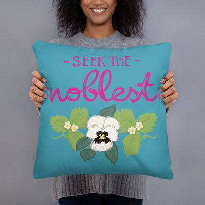 Zeta Tau Alpha Motto Pillow in turquoise held up by model