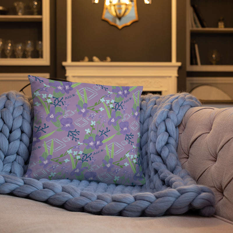 Alpha Delta Pi Alphie The Lion Pillow showing floral print on couch