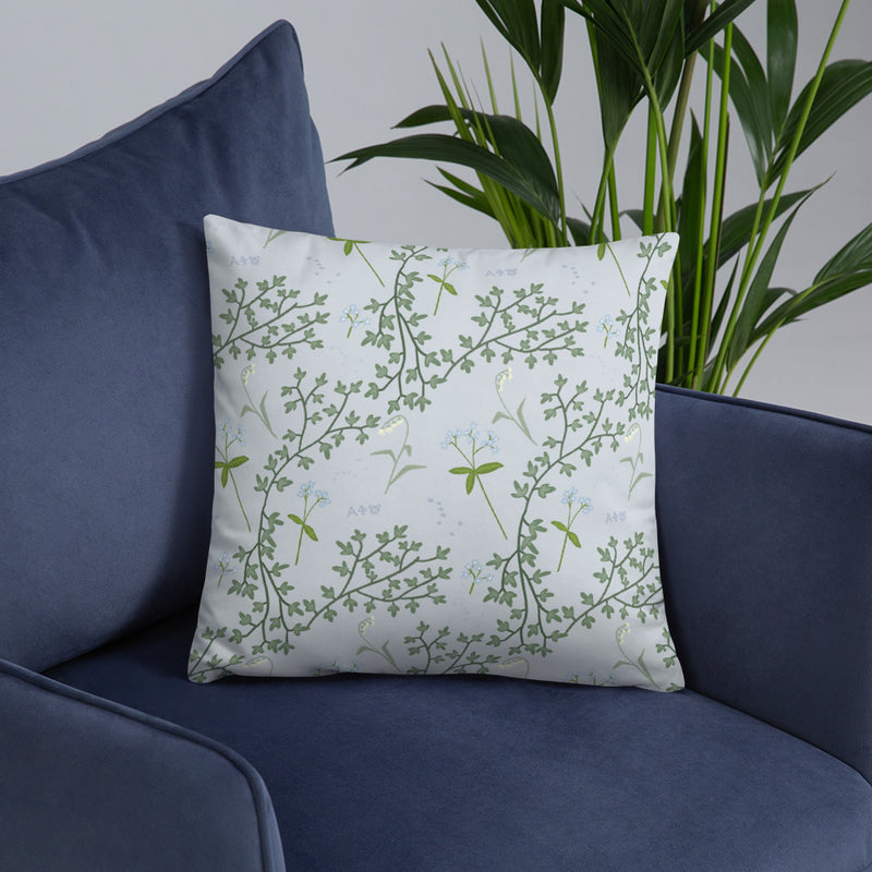 Alpha Phi Lily of the Valley and Ivy Silver Pillow shown on blue chair