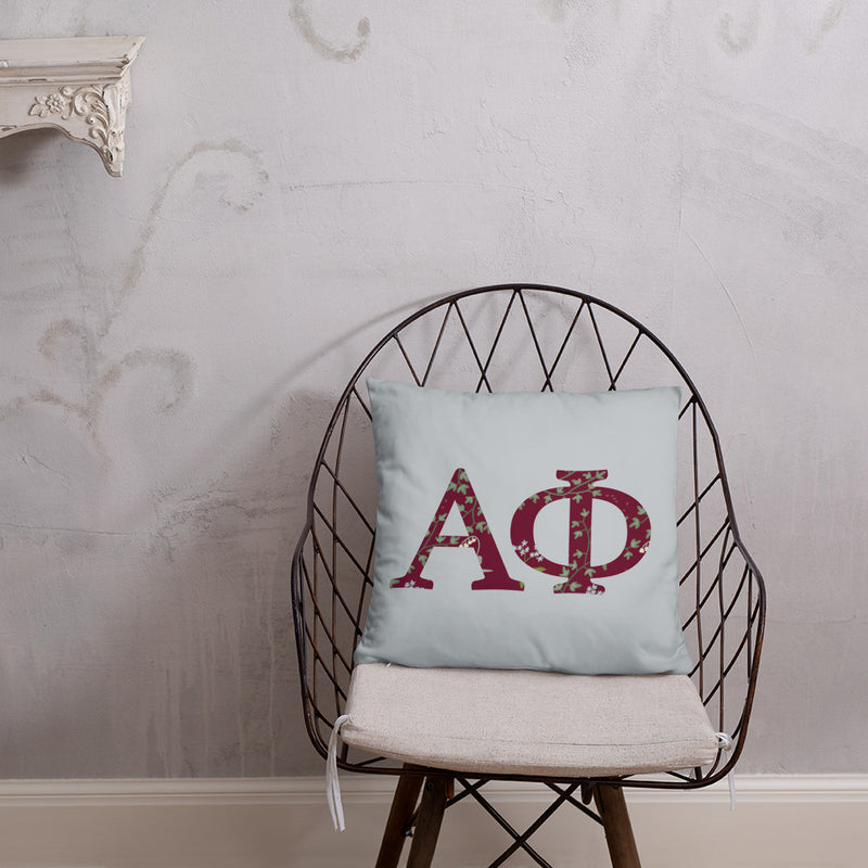 Alpha Phi Greek Letters Silver Pillow in chair
