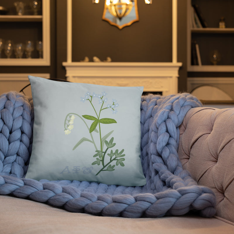 Alpha Phi Lily of the Valley and Ivy Silver Pillow shown on couch