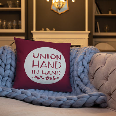 Alpha Phi Union Hand in Hand Pillow, Bordeaux on couch