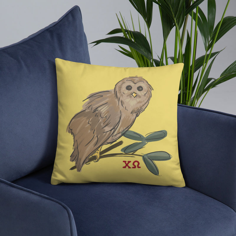 Chi Omega Owl Mascot Pillow shown on blue chair