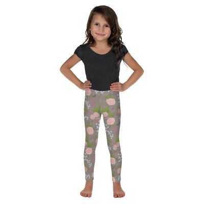 Gamma Phi Beta Carnation Floral Print Kid's Leggings, A La Mode on child showing front view