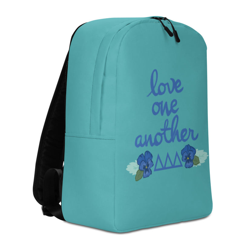 Tri Delta Love One Another Minimalist Turquoise Backpack showing left side