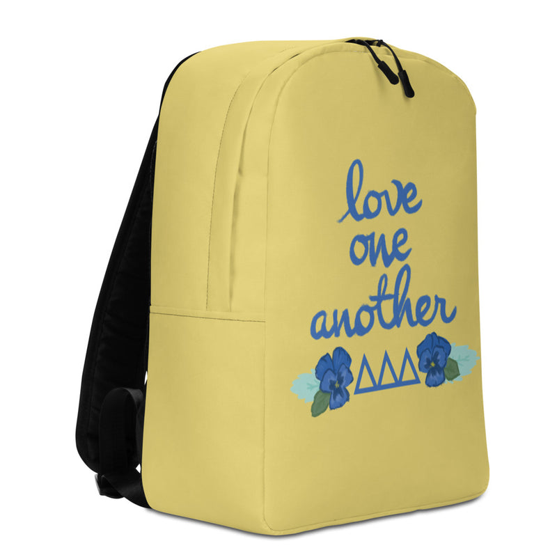 Tri Delta Love One Another Gold Backpack showing left side of backpack