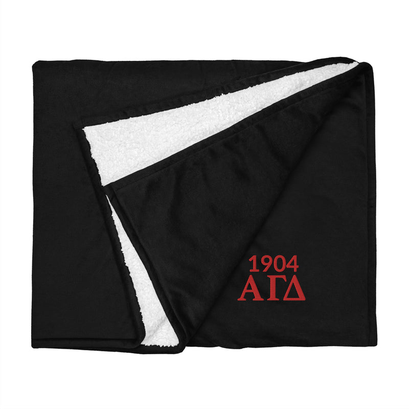 Alpha Gamma Delta Sorority Blanket in black shown flat