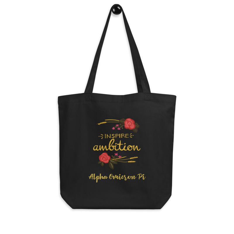 Alpha Omicron Pi Sorority Tote Bag in black shown on hook with motto design