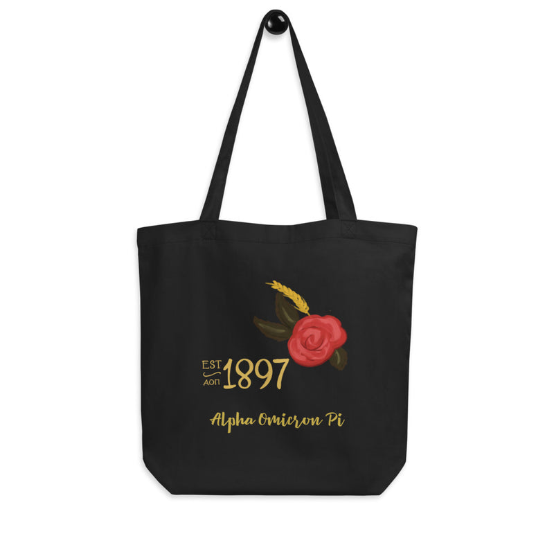 Alpha Omicron Pi Sorority Tote Bag in black on a hook with 1897 design