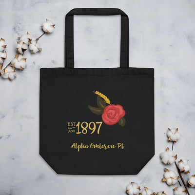 Alpha Omicron Pi Sorority Tote Bag in black shown with cotton blossoms