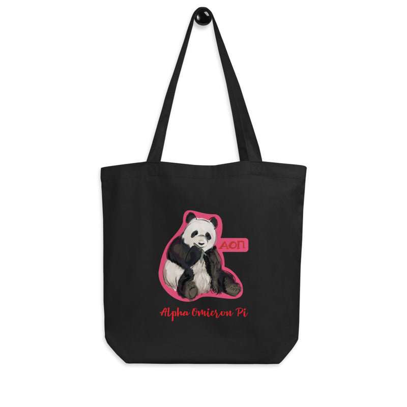 Alpha Omicron Pi Sorority Tote Bag shown in black with panda design on a hook