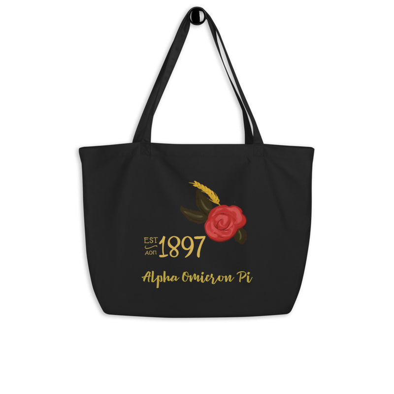 Alpha Omicron Pi Sorority Tote Bag in black shown on a hook with 1897 design