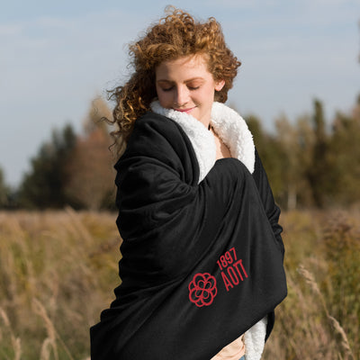 Alpha Omicron Pi Plus Embroidered Sherpa Blanket in black on model
