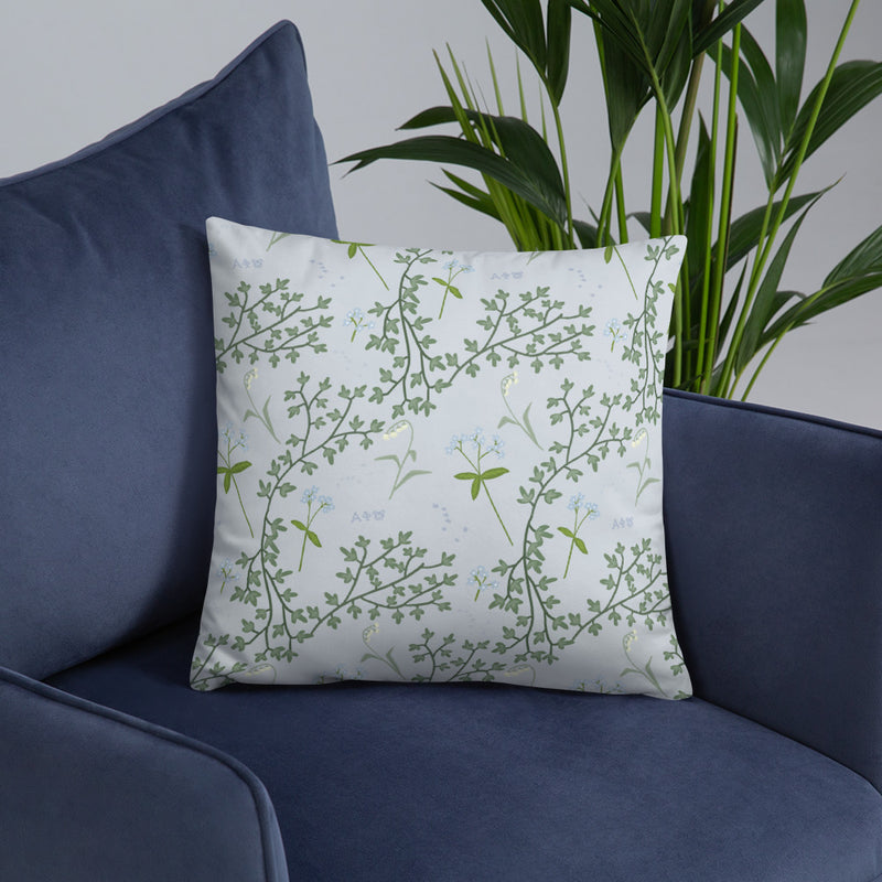 Alpha Phi Sorority Pillow shown on blue chair with floral print