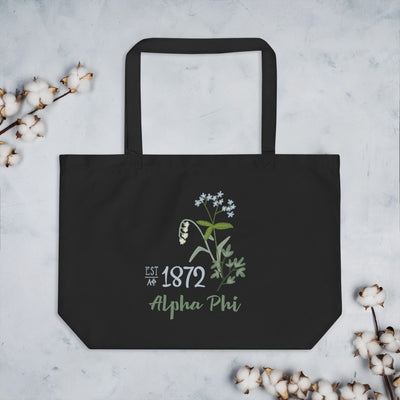 Alpha Phi Sorority Tote Bag in black with 1872 design shown with cotton blossoms