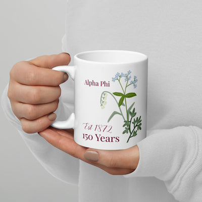 Alpha Phi 150th Anniversary Commemorative Mug in model's hands