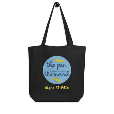 Alpha Xi Delta Pen is Mightier Eco Tote Bag showin in black on a hook