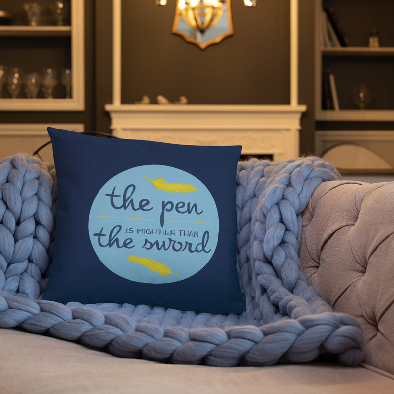 Alpha Xi Delta The Pen Is Mightier Than the Sword Pillow shown on couch