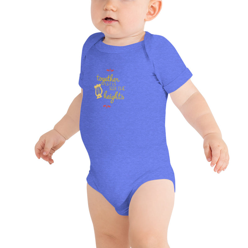Alpha Chi Omega Together Let Us Seek The Heights Baby Onesie in blue shown on infant
