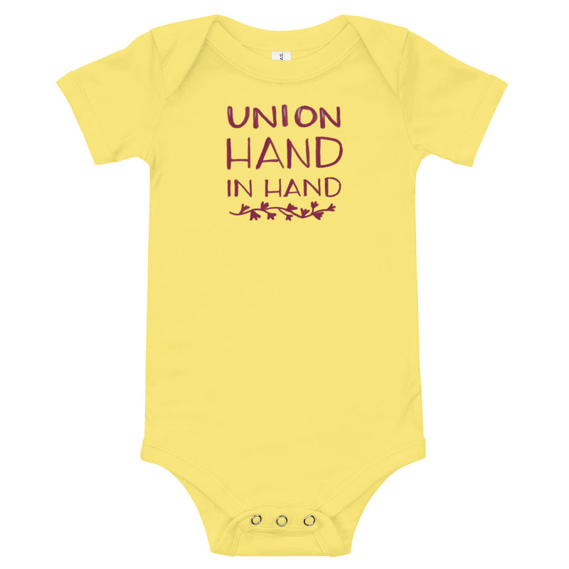 Alpha Phi "Union Hand in Hand" baby onesie in yellow