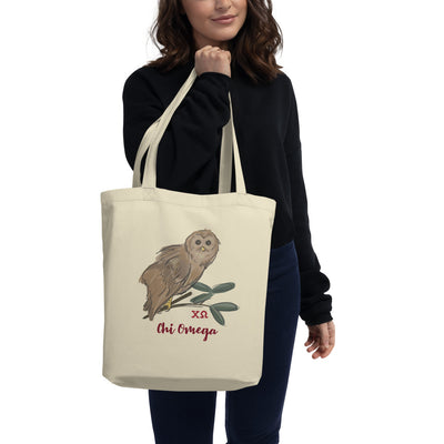 Chi Omega Owl Eco Tote Bag in natural oyster shown in model's hands 