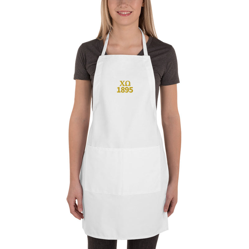 Chi Omega Embroidered Apron in white with gold embroidery shown full length on model