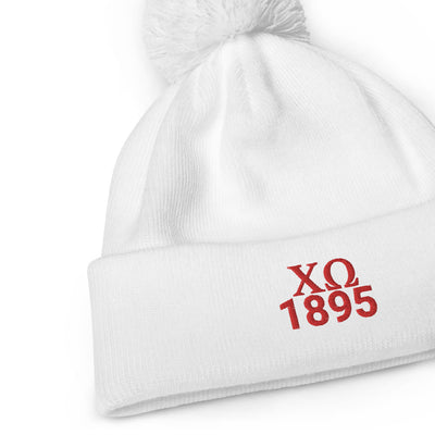 Chi Omega Sorority Pom Pom Beanie in white with red embroidery in close up view