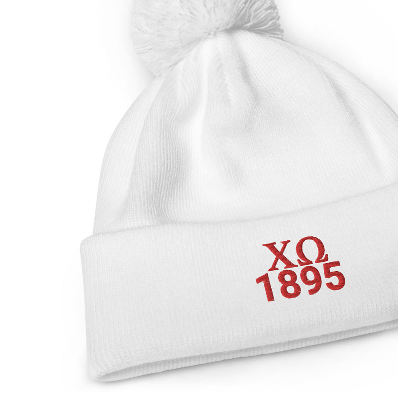 Chi Omega Sorority Pom Pom Beanie in white with red embroidery in close up view