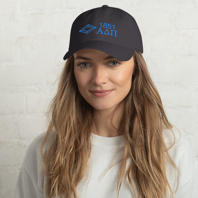 Our Alpha Delta Pi 1851 baseball cap featured in charcoal gray with blue embroidery.