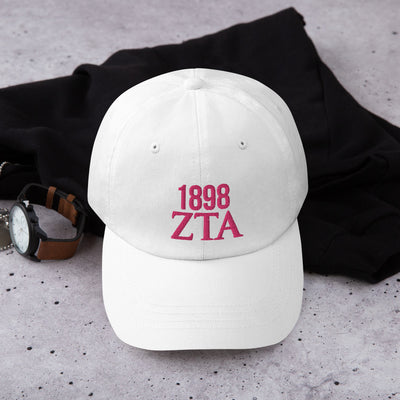 Zeta Tau Alpha 1898 Founding Year Baseball Hat with Pink Embroidery in lifestyle photo in white