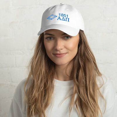 Our Alpha Delta Pi 1851 baseball cap featured in white with blue embroidery.