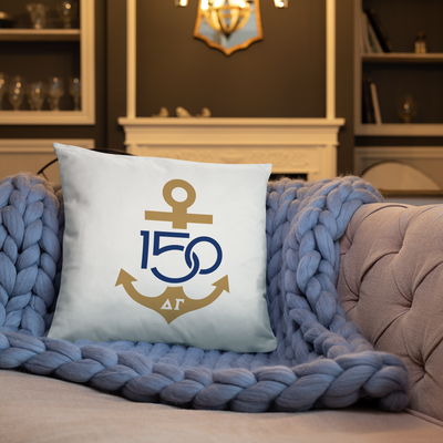 Delta Gamma Sorority Pillow with 150th logo in Navy and Bronze shown on couch