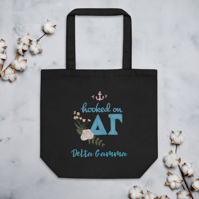 Delta Gamma Hooked on DG Sorority Tote Bag shown in black with cotton blossoms