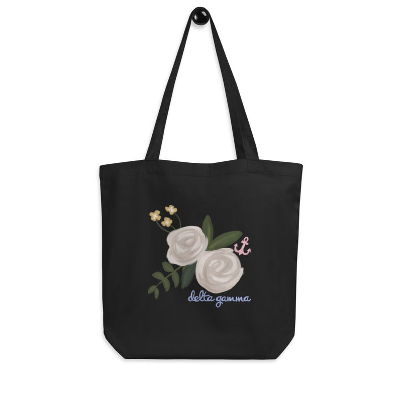 Delta Gamma Rose and Anchor Tote Bag in black shown hanging on a hook