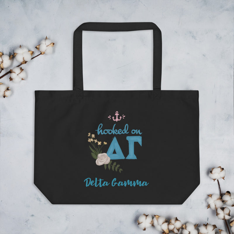 Delta Gamma Hooked on DG Sorority Tote Bag in extra large size shown with cotton blossoms