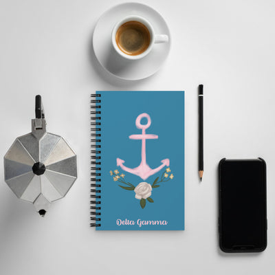 Delta Gamma Anchor Sorority Notebook in lifestyle setting with pink anchor design