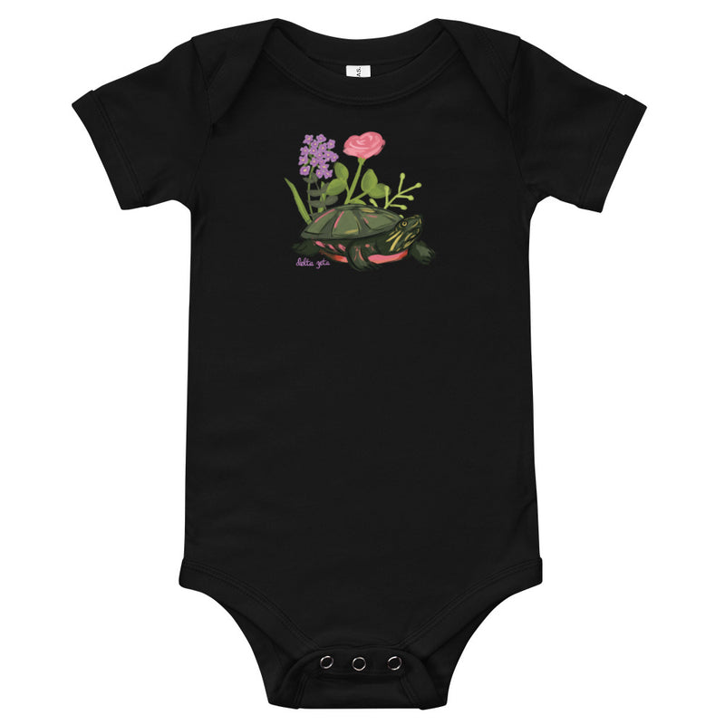 Delta Zeta Turtle Baby Onesie in black shown flat with turtle mascot design