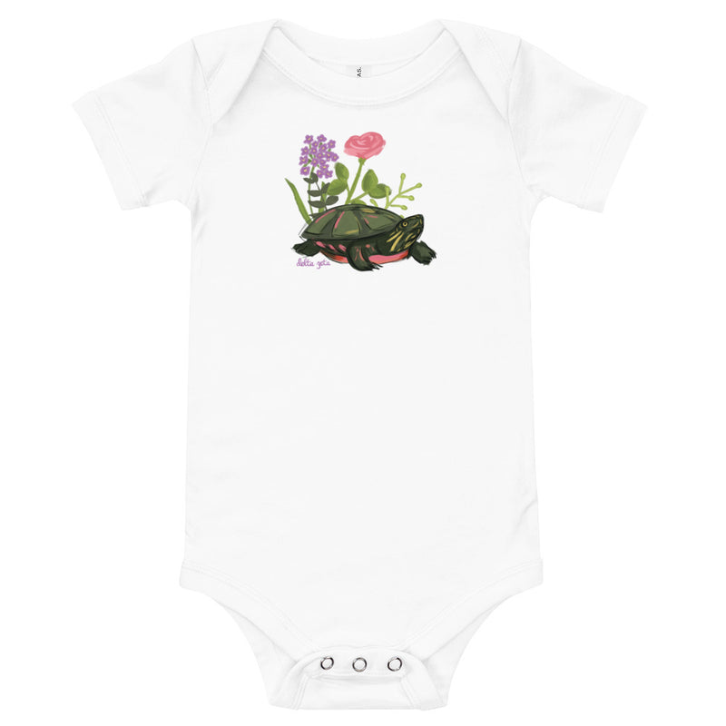 Delta Zeta Turtle Baby Onesie in white shown flat with turtle mascot design