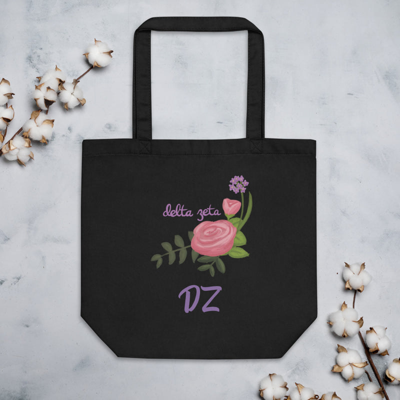 Delta Zeta Sorority Tote Bag in black shown flat with cotton blossoms